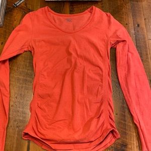Athleta ladies sweater/top.  Orange/peach color. Medium